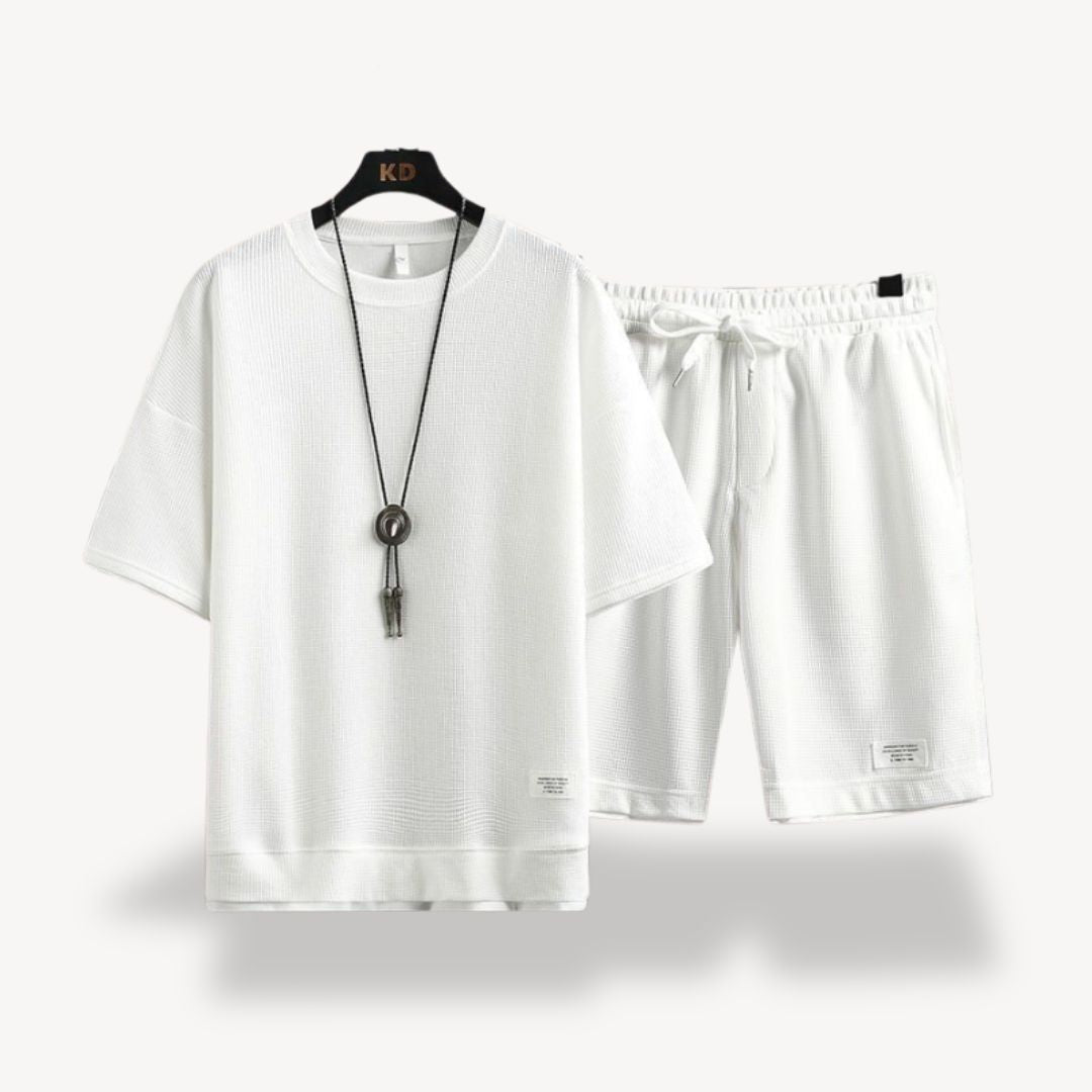 "Men wearing dark gray cotton jersey shorts set, showcasing relaxed fit and minimalist design for casual comfort"