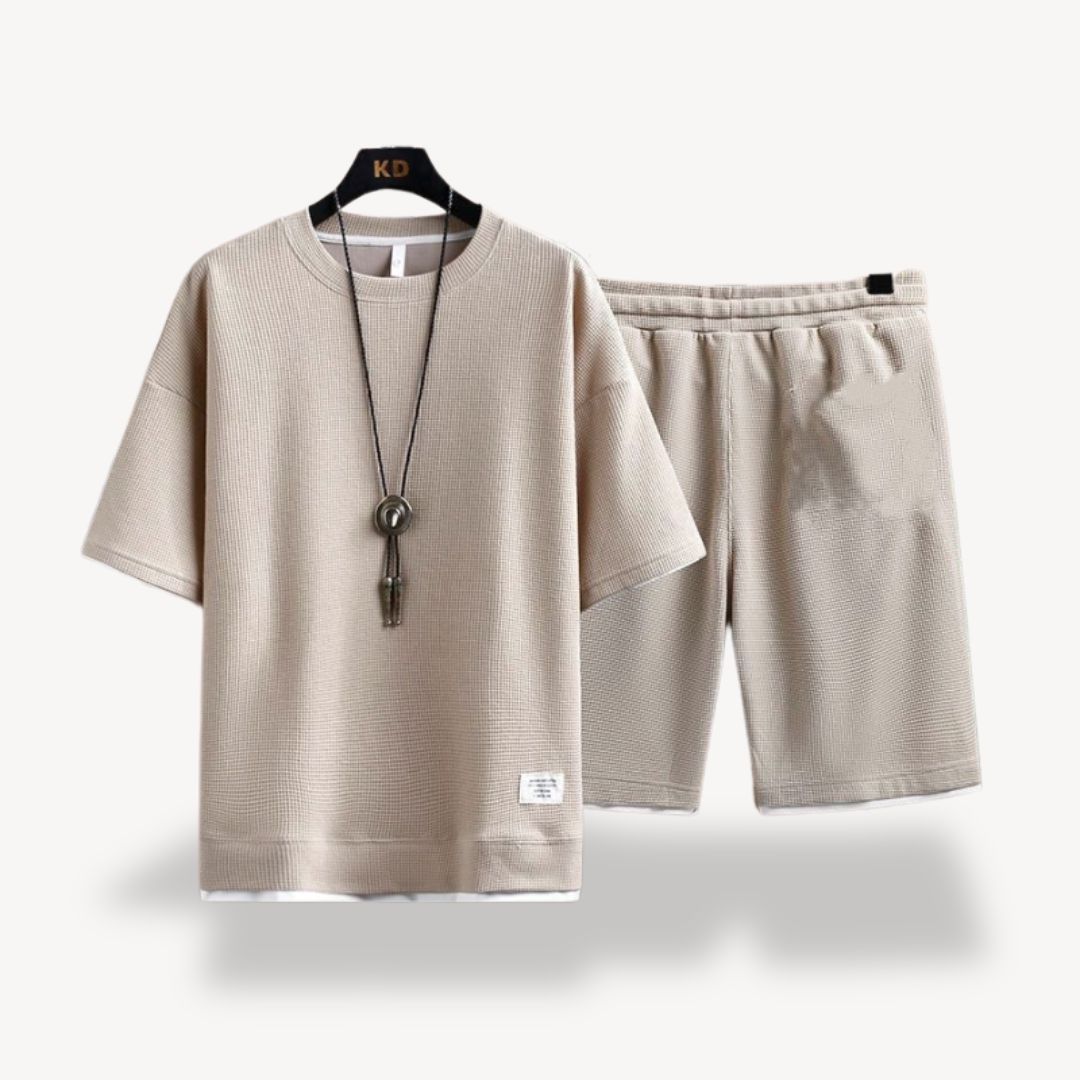 "Men wearing dark gray cotton jersey shorts set, showcasing relaxed fit and minimalist design for casual comfort"