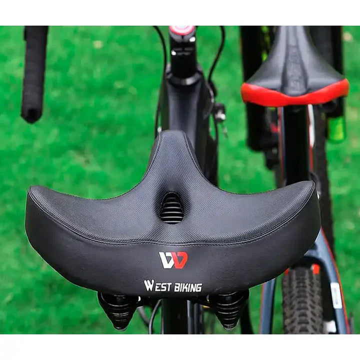 "Men's bike saddle with wide seat, ergonomic design, memory foam padding, black synthetic leather, and universal fit compatib