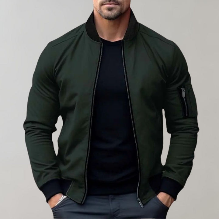"Men's blue bomber jacket with zipper pockets, stylish fit, lightweight fabric, perfect for cool evenings."