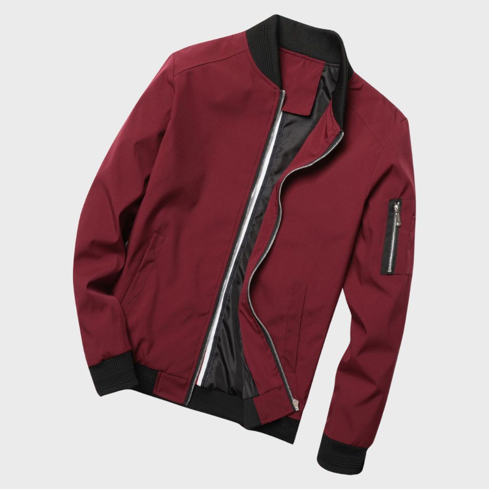 "Men's blue bomber jacket with zipper pockets, stylish fit, lightweight fabric, perfect for cool evenings."