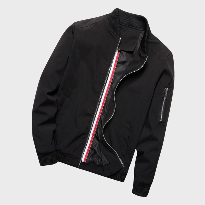 "Men's blue bomber jacket with zipper pockets, stylish fit, lightweight fabric, perfect for cool evenings."