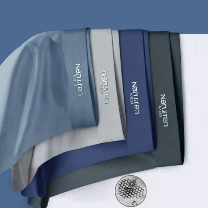 "Men's breathable boxers 4-pack, moisture-wicking, soft fabric, elastic waistband, stylish colors, comfortable fit."