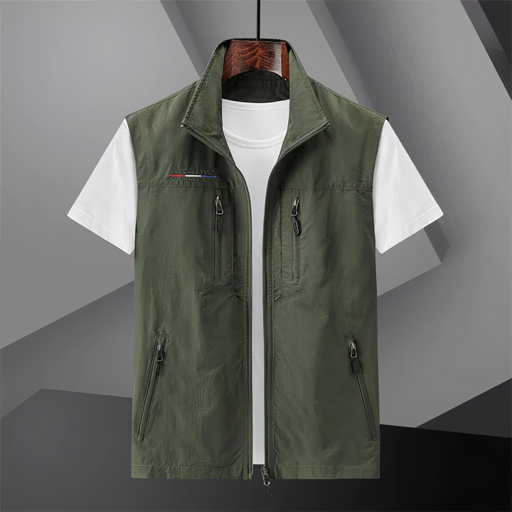 Men's cotton utility vest with multi-pockets, shown in black; ideal for outdoor activities like hiking and fishing.