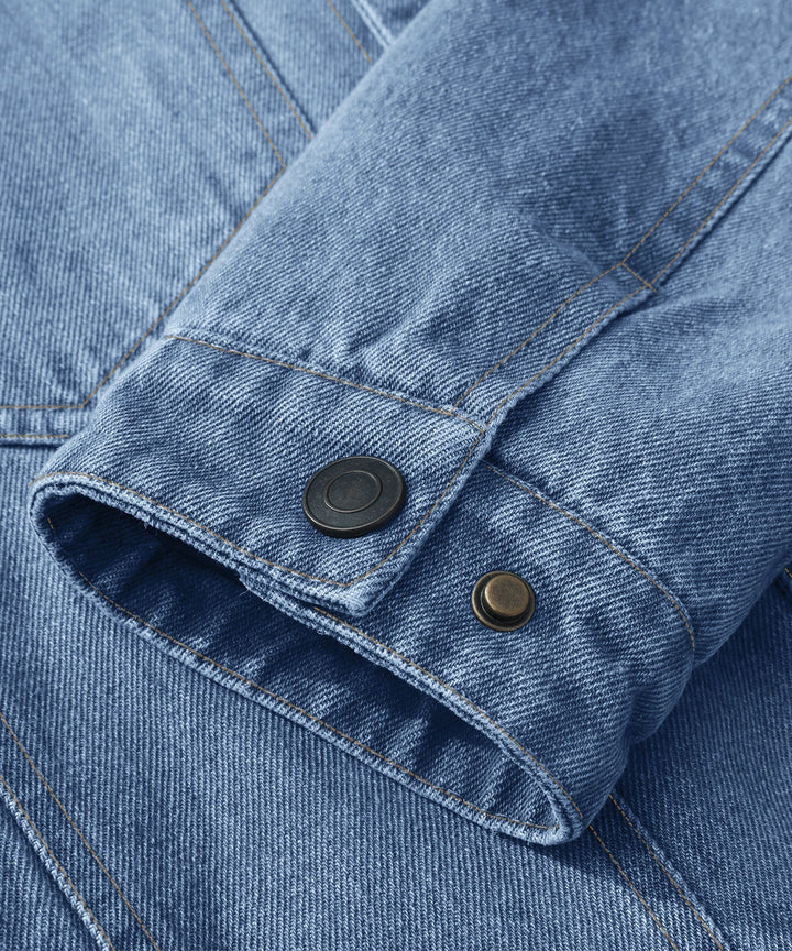 Men's denim wanderer jacket, flannel-lined, brown color, dual chest pockets, button-front closure, rugged and stylish.