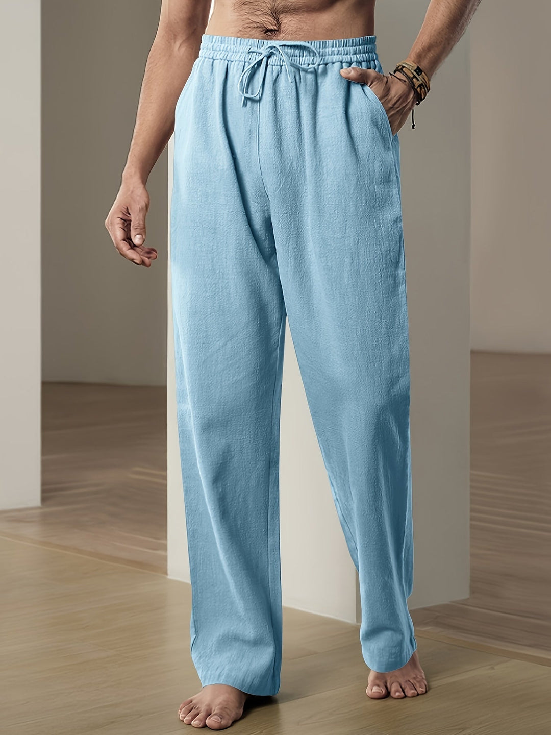 "Men's lightweight relaxed fit lounge trousers with drawstring waist, breathable fabric, shown in stylish grey tone."