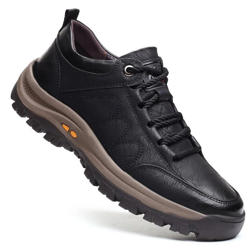 Men's black orthopedic shoe on a white background