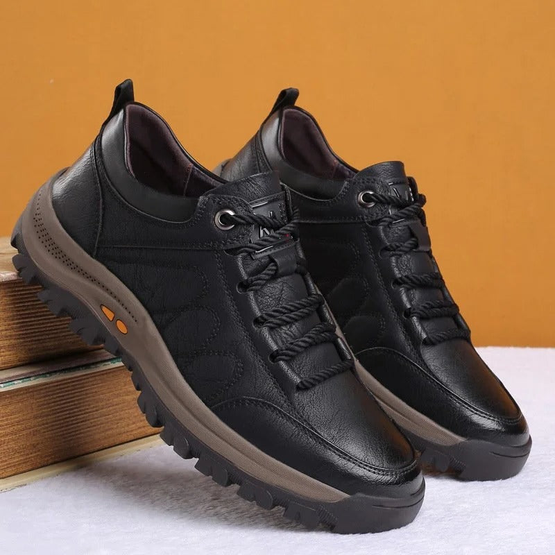 Men's black orthopedic shoe detail showing texture