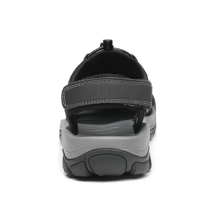 "Men's outdoor trekking sandals with mesh upper, breathable material, black color, durable sole, perfect for hiking adventure