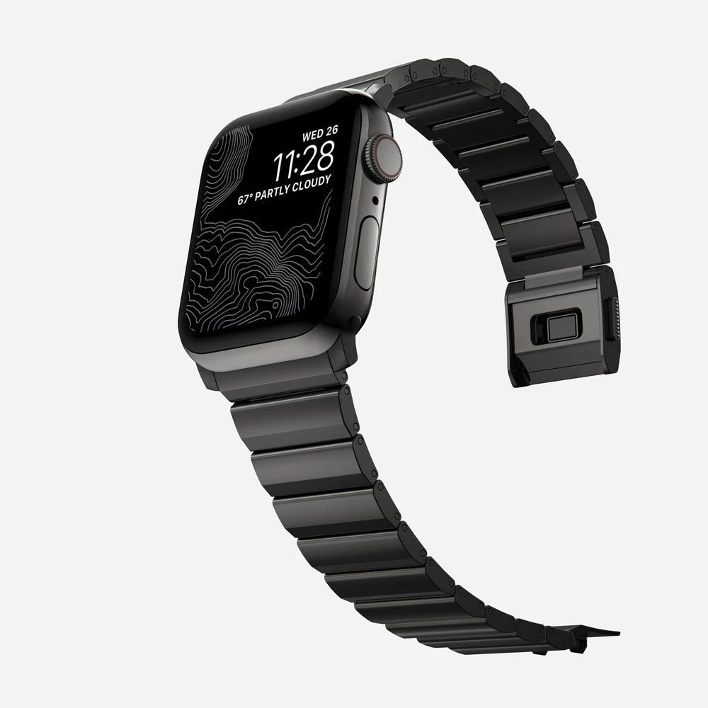 Men's sleek titanium watch band with shiny finish, magnetic clasp, durable and lightweight; perfect for daily or formal wear.