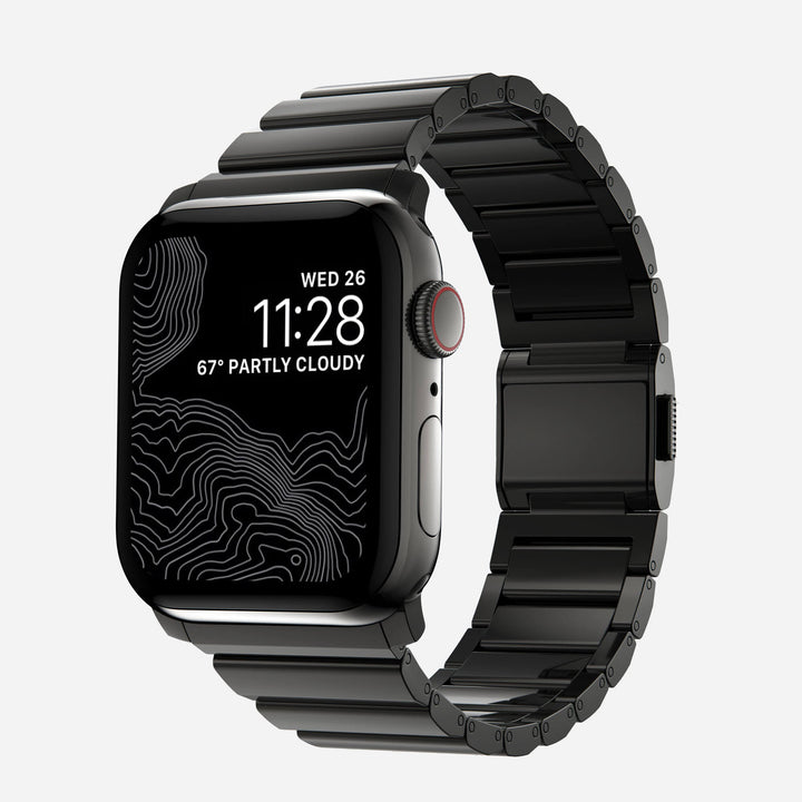 Men's sleek titanium watch band with shiny finish, magnetic clasp, durable and lightweight; perfect for daily or formal wear.