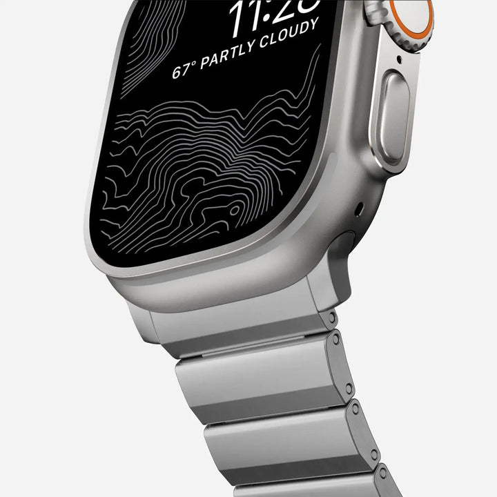 Men's sleek titanium watch band with shiny finish, magnetic clasp, durable and lightweight; perfect for daily or formal wear.
