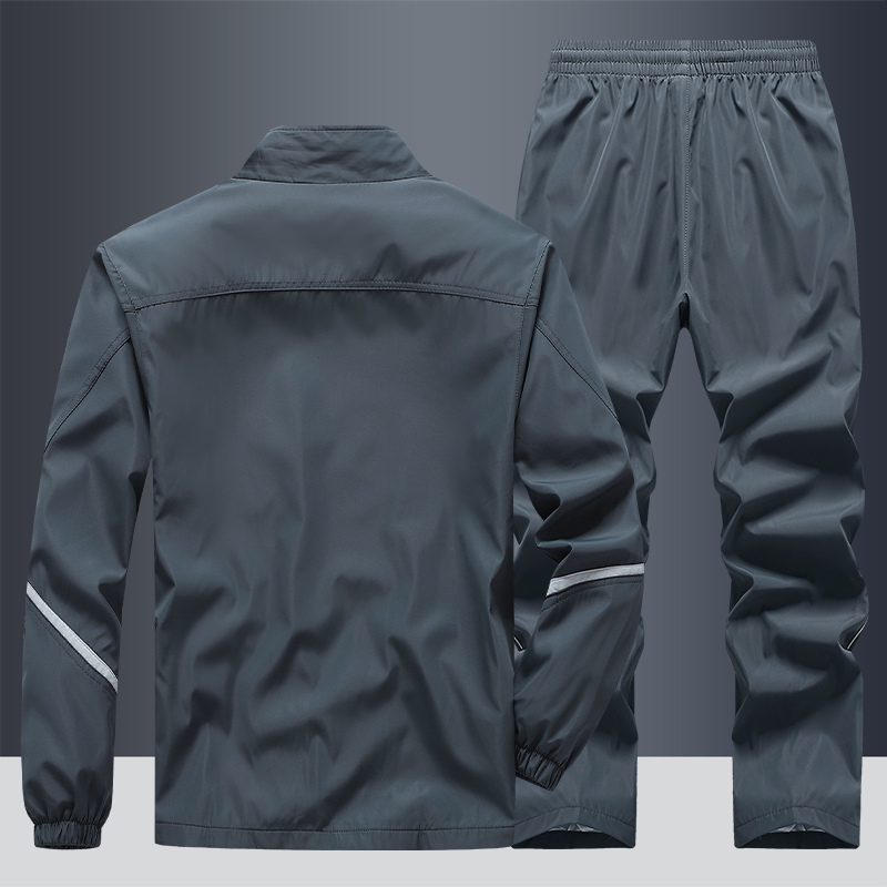 "Men's two-piece striped tracksuit with zip jacket and drawstring joggers, bold stripe design, comfortable fabric."