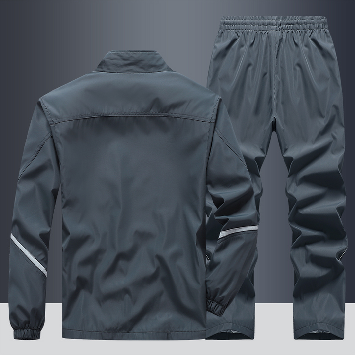 "Men's two-piece striped tracksuit with zip jacket and drawstring joggers, bold stripe design, comfortable fabric."
