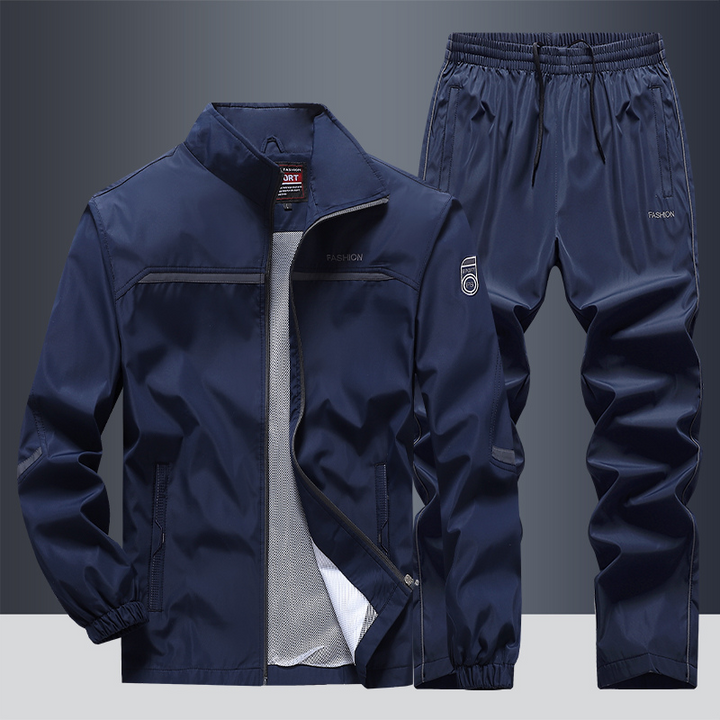 "Men's two-piece striped tracksuit with zip jacket and drawstring joggers, bold stripe design, comfortable fabric."