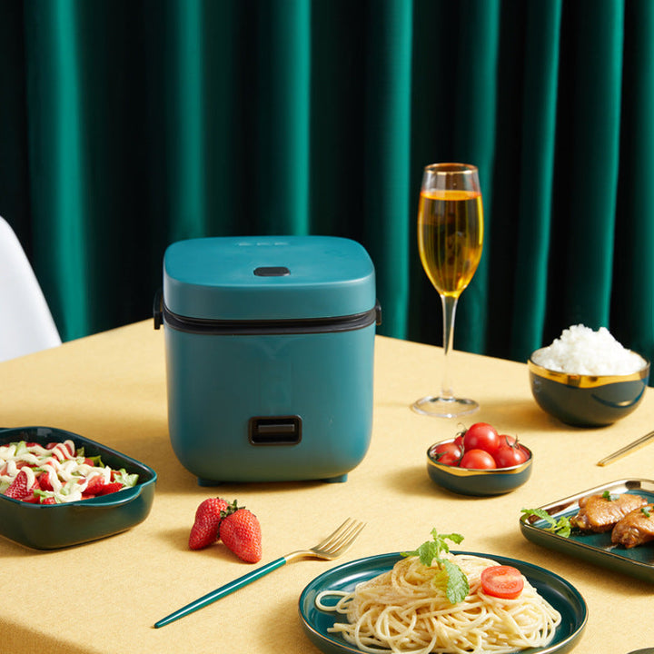 "Mini rice cooker and steamer, compact design for 1-2 people, 1.2L capacity, in green, ideal for small kitchens or travel."