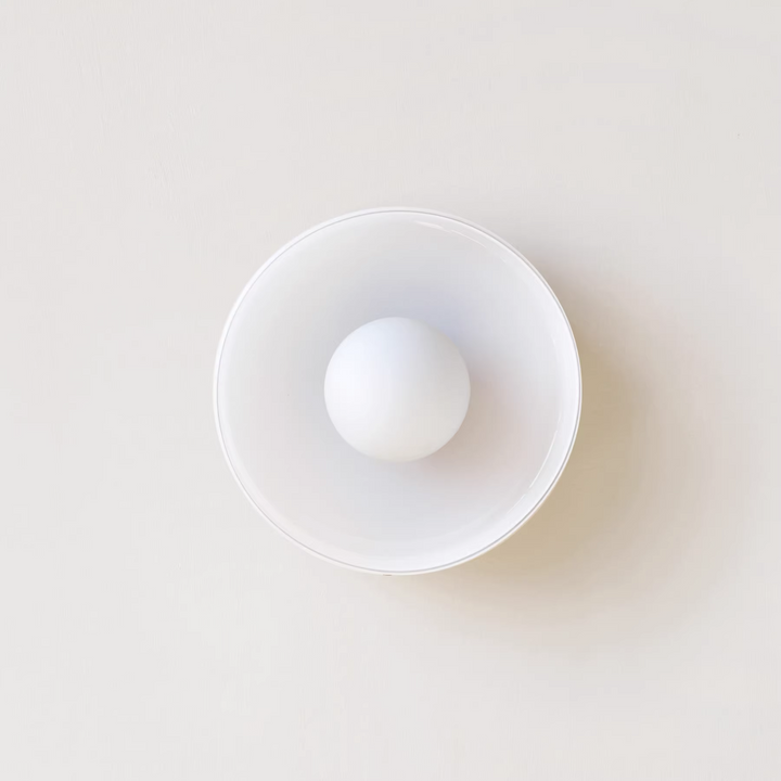 "Minimal flush mount ceiling light with frosted shade, sleek finish, offers soft illumination; ideal for modern and tradition