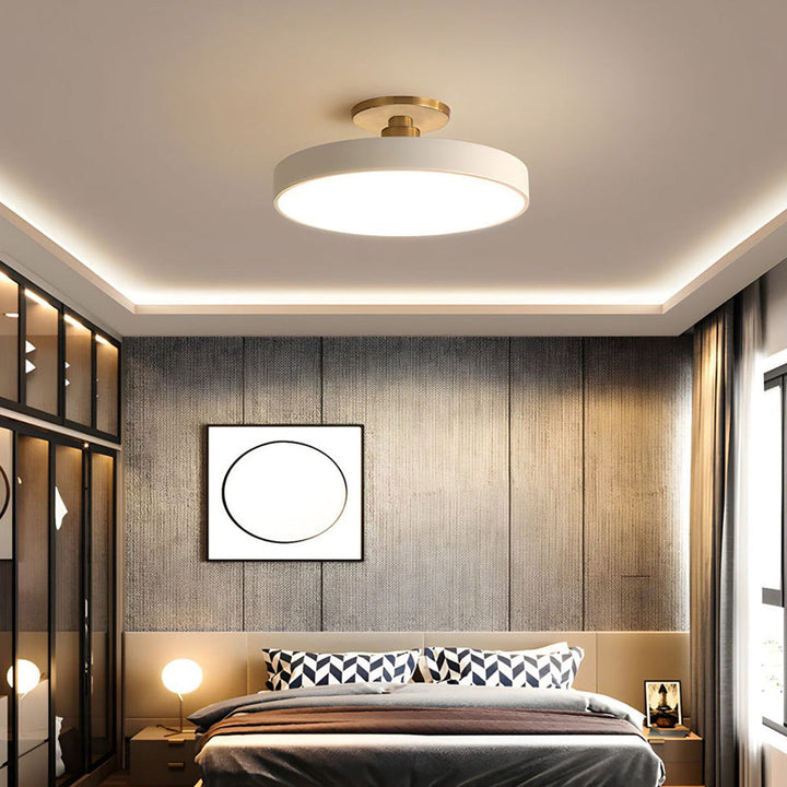 "Minimalist LED ceiling light, semi-flush design, brightens spaces with elegant style and energy-efficient glow."