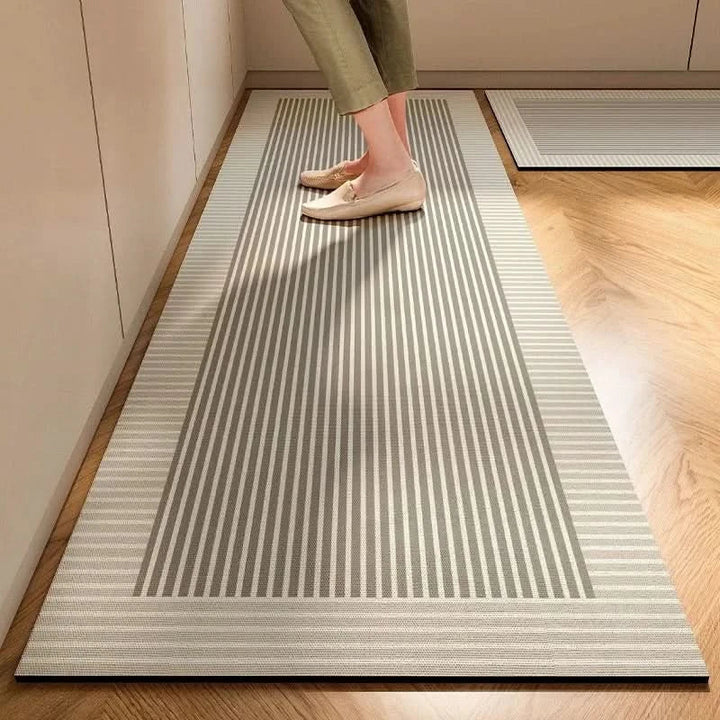 Soft, anti-fatigue comfort mat for kitchen floors. Non-slip design ensures safety in minimalist kitchens.