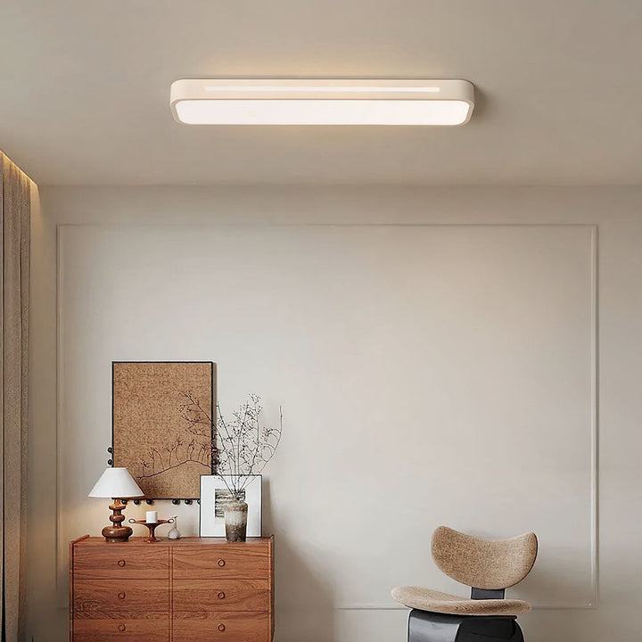 "Minimalist Nordic long LED ceiling light with sleek black finish and modern design for elegant interior lighting"