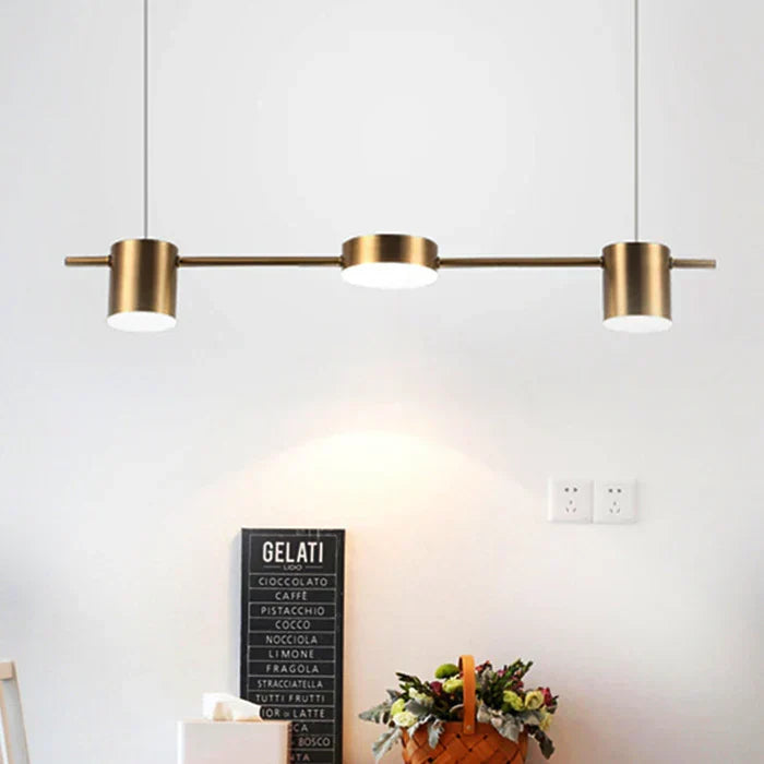 AuraDrum modern drum pendant light, elegantly suspended above a dining table for stylish lighting.