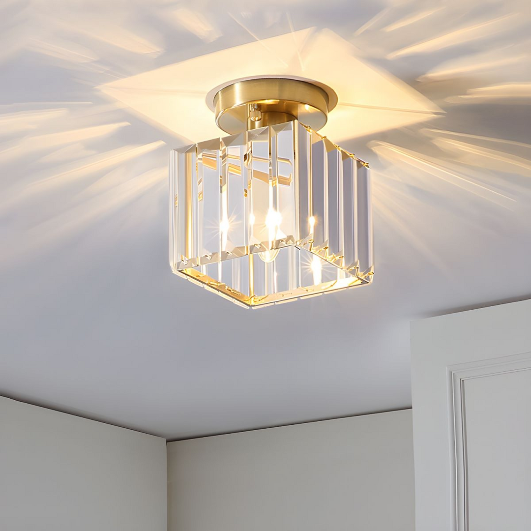 Modern black crystal flush mount ceiling light, sleek brass fixture, crystal shade, ideal for rooms with low ceilings.