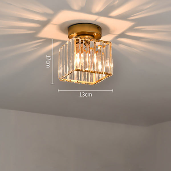 Modern black crystal flush mount ceiling light, sleek brass fixture, crystal shade, ideal for rooms with low ceilings.