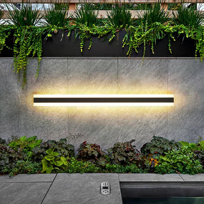 Bright RainGuard outdoor LED wall lamp installed on a house, providing weatherproof exterior lighting for porch.