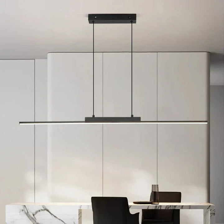 "Modern black pendant light with tubular silhouette, minimalist aluminium fixture, perfect for dining rooms and kitchens."