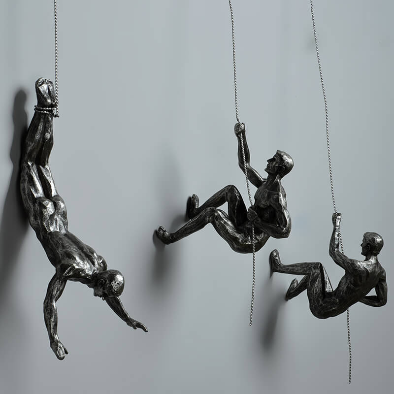 Modern climber sculpture, ideal inspirational office wall art for a sophisticated, contemporary space.