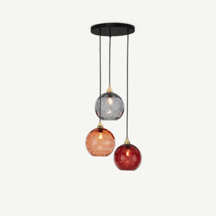 Chic modern cluster pendant light, three lamps creating a warm and inviting glow.