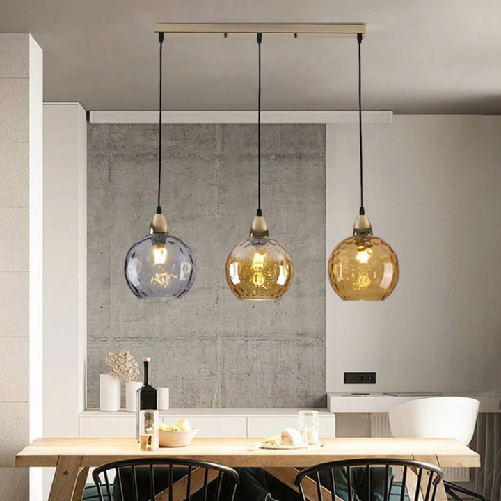 Overhead modern cluster pendant light with 3 lamps, provides ample ambient lighting.