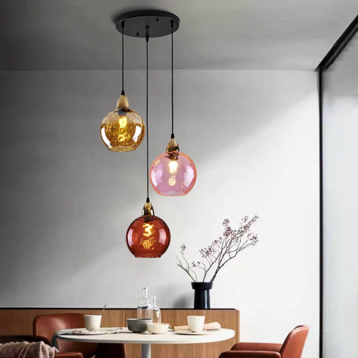 Dining room modern cluster light, 3 lamps offering focused and decorative illumination.