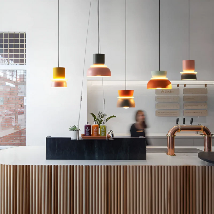 Dynamic colorful LED macaron pendant light, creating an inviting and lively atmosphere.