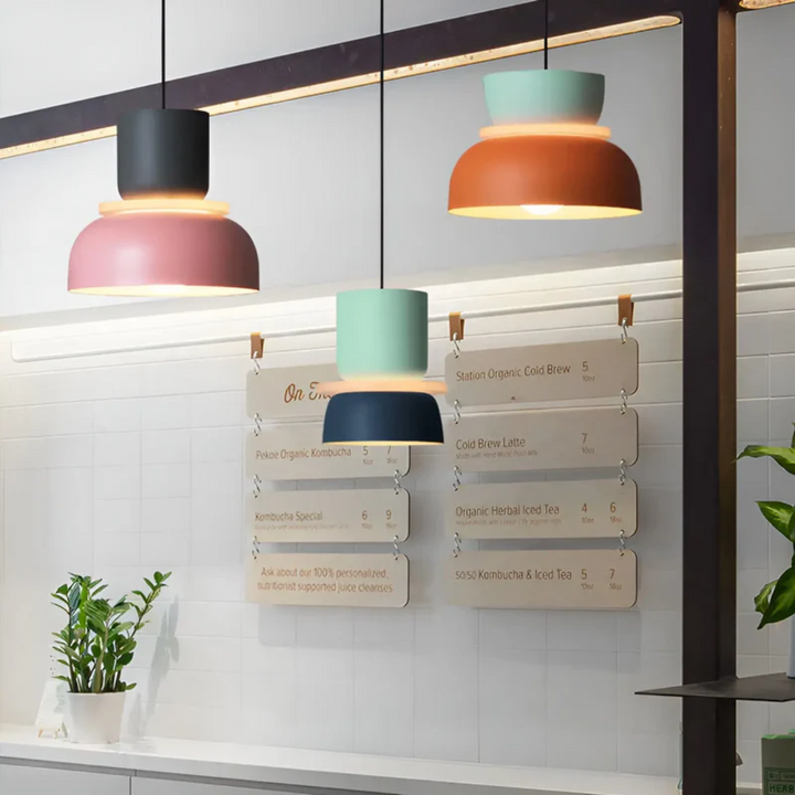 Close-up of a sleek macaron LED pendant light, highlighting its modern, vibrant design.