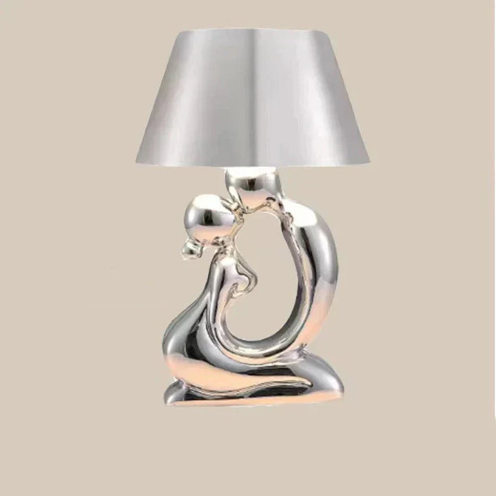 Contemporary silver table lamp, a modern designer piece. Elegant lighting solution for any home, office, or bedroom.