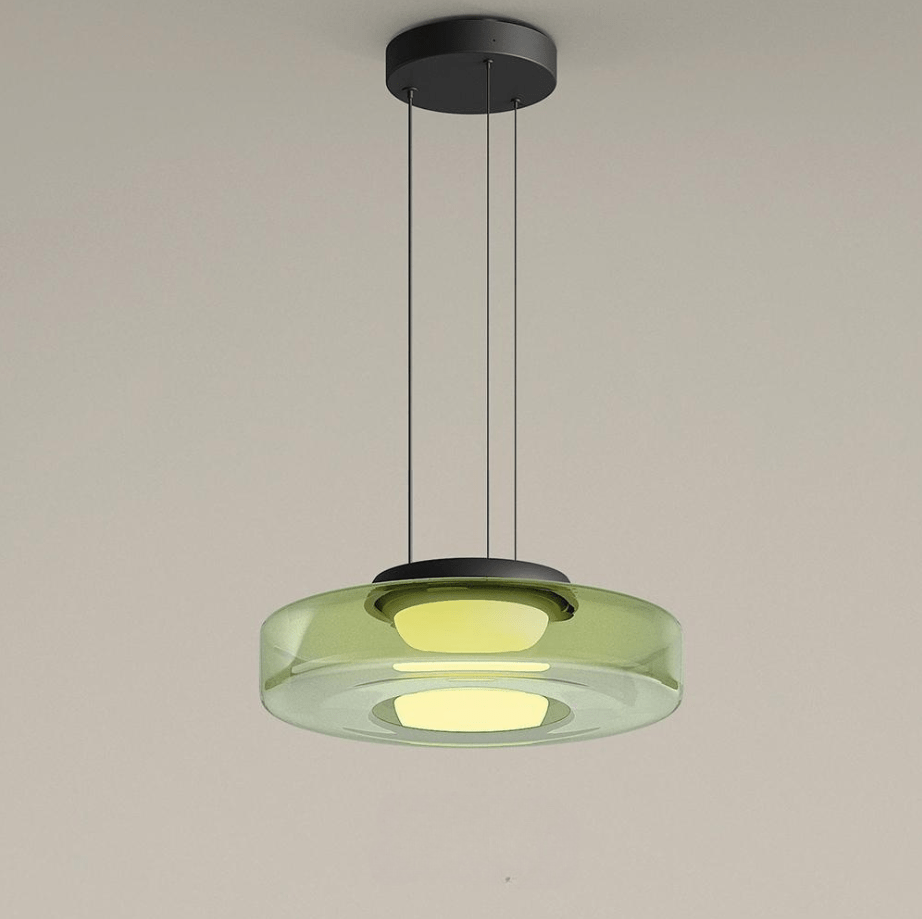 "Modern glass pendant lamp in Bauhaus design, smoke grey shade, adjustable cable, warm LED glow, ideal for home interiors."