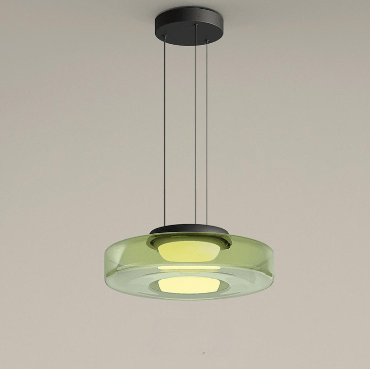 "Modern glass pendant lamp in Bauhaus design, smoke grey shade, adjustable cable, warm LED glow, ideal for home interiors."