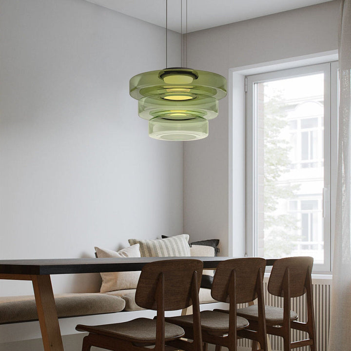 "Modern glass pendant lamp in Bauhaus design, smoke grey shade, adjustable cable, warm LED glow, ideal for home interiors."