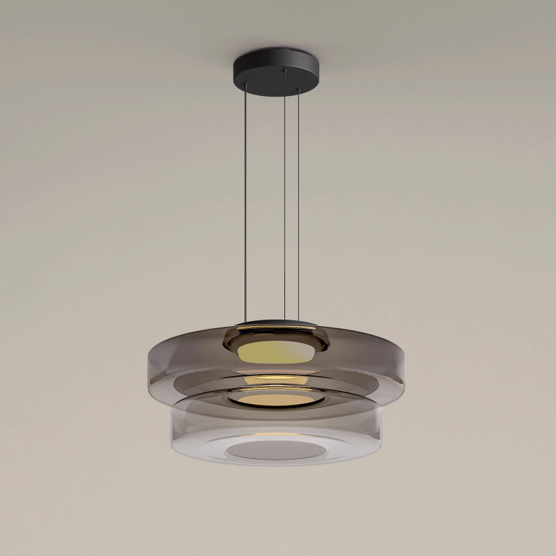 "Modern glass pendant lamp in Bauhaus design, smoke grey shade, adjustable cable, warm LED glow, ideal for home interiors."