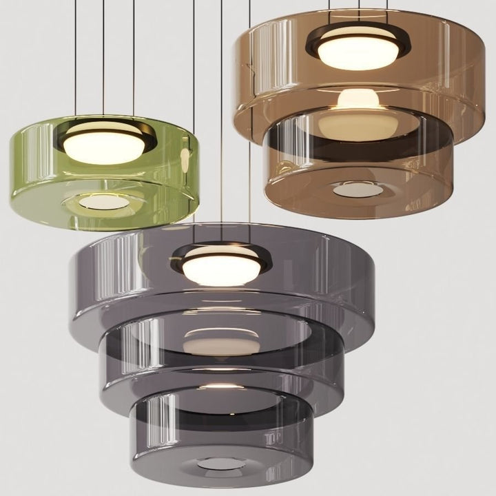 "Modern glass pendant lamp in Bauhaus design, smoke grey shade, adjustable cable, warm LED glow, ideal for home interiors."