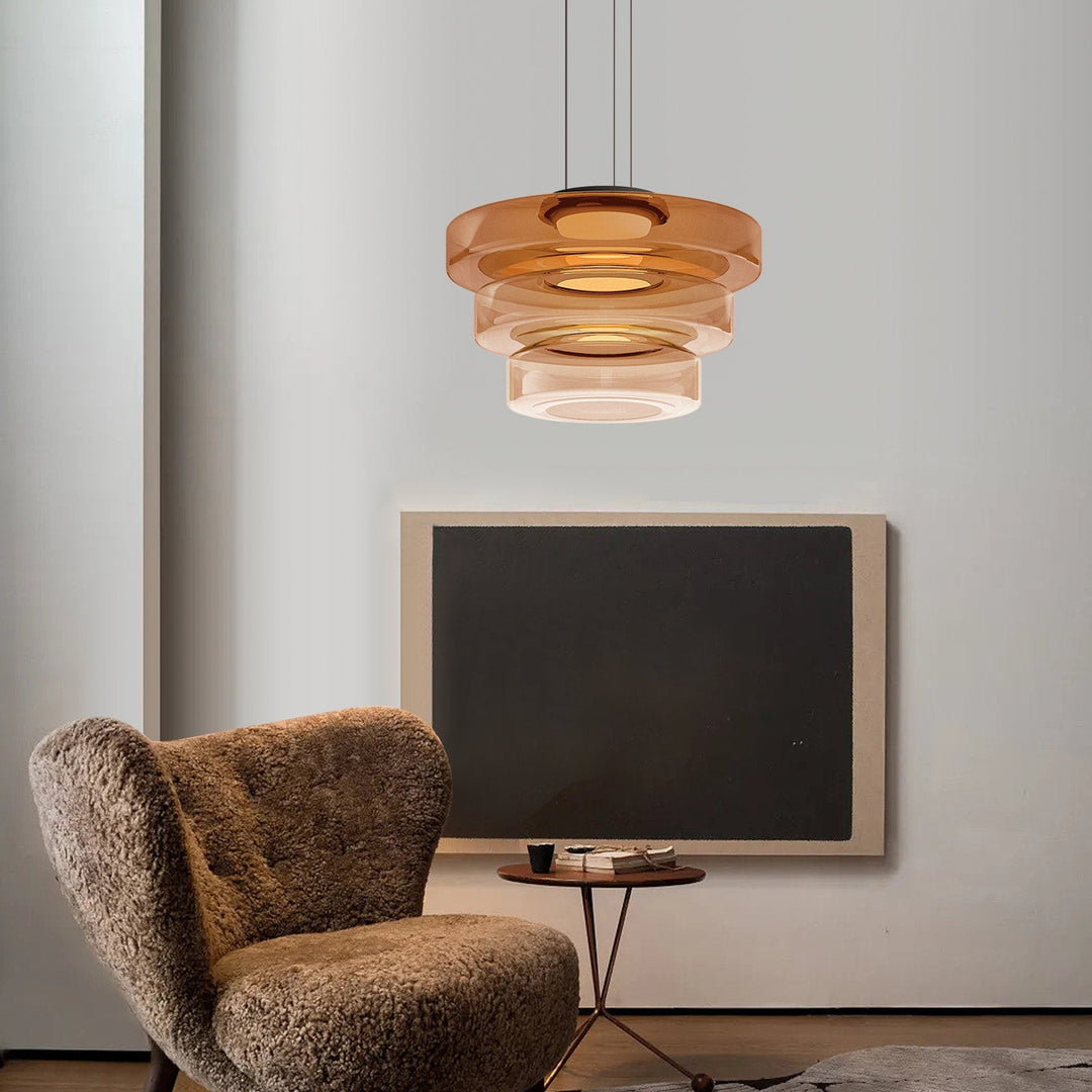 "Modern glass pendant lamp in Bauhaus design, smoke grey shade, adjustable cable, warm LED glow, ideal for home interiors."