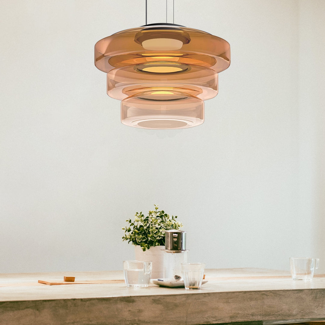 "Modern glass pendant lamp in Bauhaus design, smoke grey shade, adjustable cable, warm LED glow, ideal for home interiors."