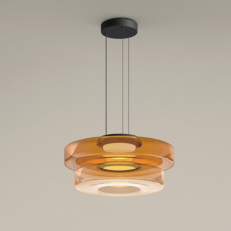 "Modern glass pendant lamp in Bauhaus design, smoke grey shade, adjustable cable, warm LED glow, ideal for home interiors."