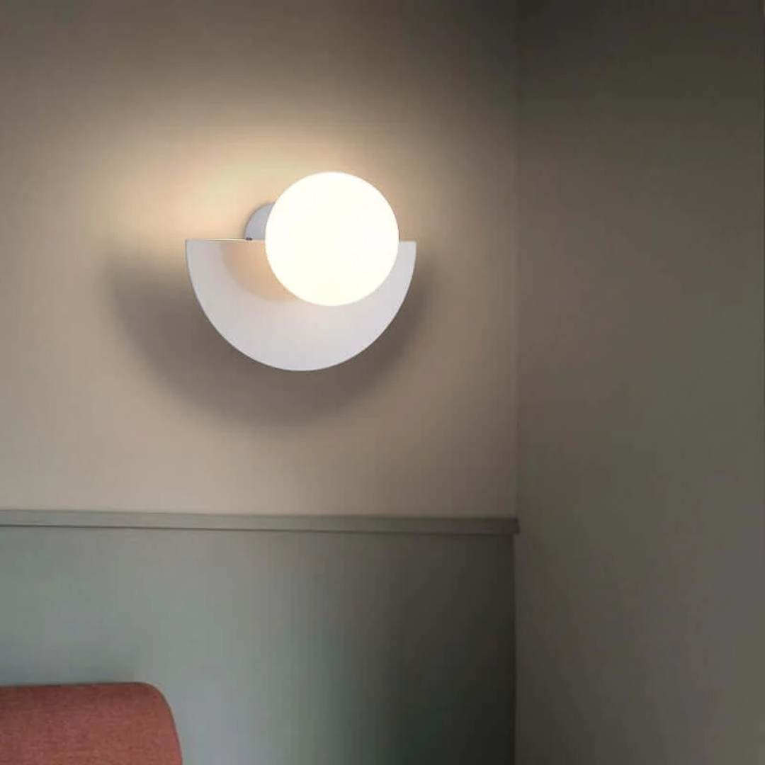 Modern half moon metal LED wall lamp, perfect for contemporary home decor & ambient lighting.