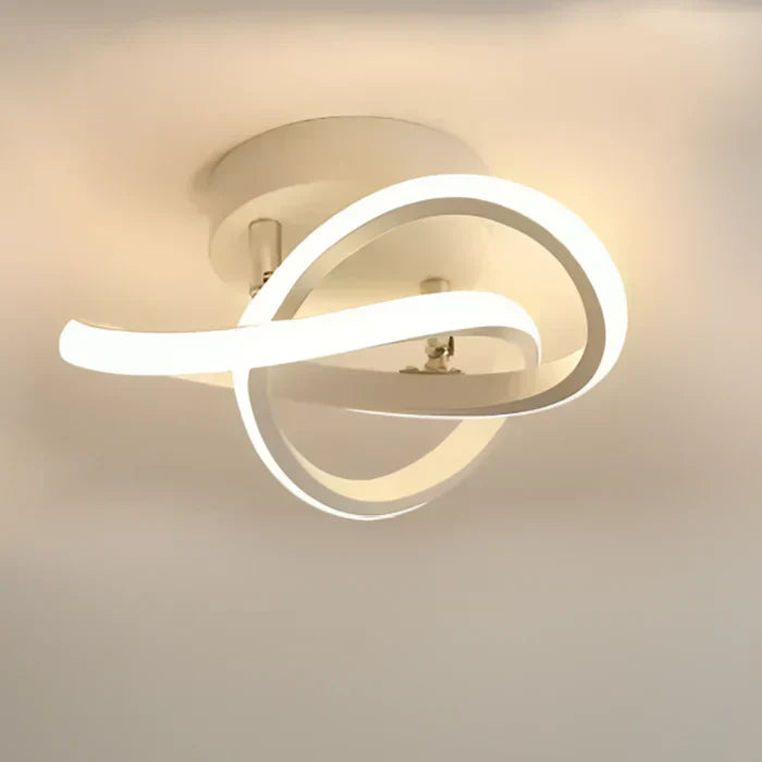 "Twilight Rings" modern LED ceiling lamp. Dual geometric design offers energy-efficient illumination & style.