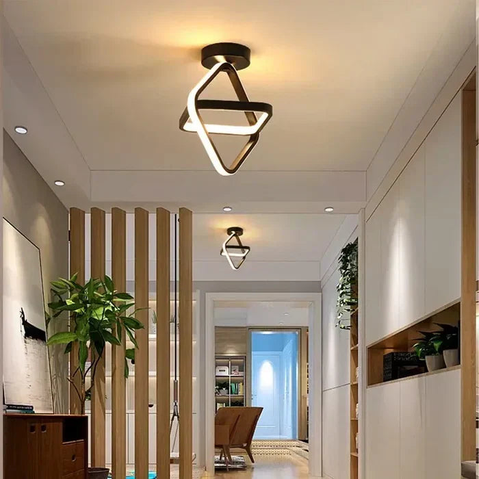 Stylish geometric LED ceiling light featuring a double ring design. Enhances modern home decor.