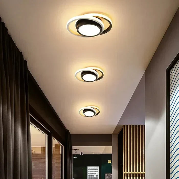 Energy-efficient LED ceiling lamp with a sleek dual-ring design. Provides warm white light for interiors.