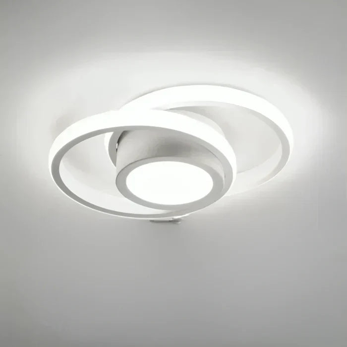 Flush-mount modern LED ceiling lamp with stylish dual rings. Perfect ambient lighting for contemporary homes.