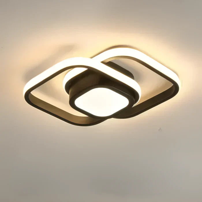 Elegant LED ceiling lamp featuring a captivating double ring design. Enhances modern living and office spaces.